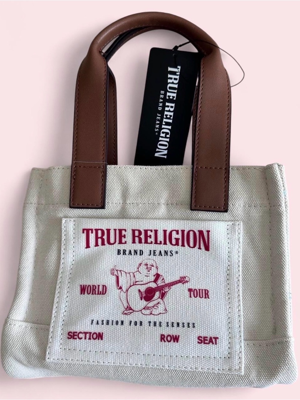 True Religion Cream Canvas Tote with Brown Handles and Pink Logo